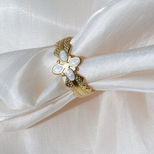The Laurel Quatrefoil Ring on silk cloth