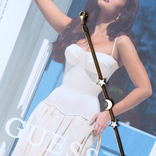 guess woman wearing Enamel Celestial Flat Snake Chain