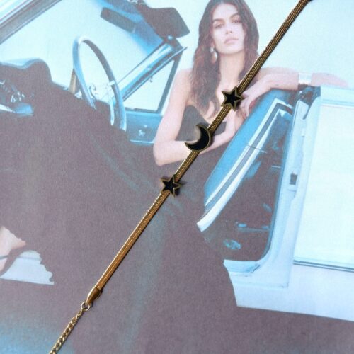 black dress woman wearing Enamel Celestial Flat Snake Chain