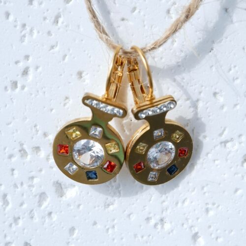 Multi-Color Square Crystal Medallion Drops on a plaster background